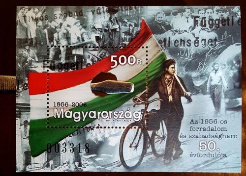 During the 1956 Revolution, protesters cut out the communist coat of arms from the flag. This souvenir sheet marking the 50th anniversary was produced with a hole in the center where the coat of arms would be.